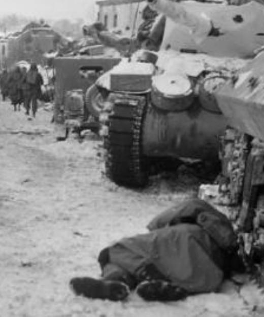 US tank column in a destroyed hamlet