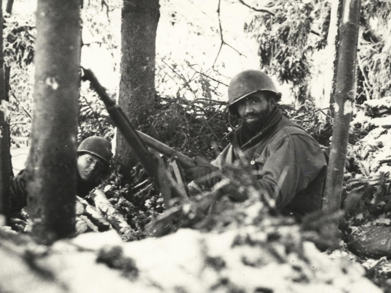 US soldiers in a snowy forest